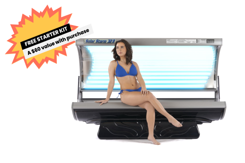 Solar Storm 32r Tanning Bed with 32 lamps opened with model sitting