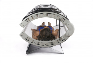 Solar Storm 32r Tanning Bed with 32 lamps closed, model laying down inside